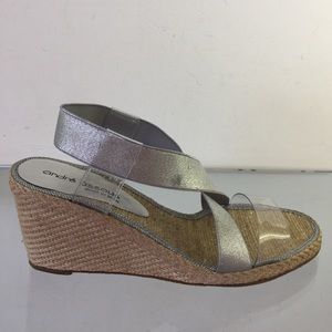 Espadrille silver elastic sandal with clear strap.